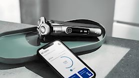 מכונת הגילוח Philips I9000 לצד אפליקציית התפעול שלה, צילום: פיליפס